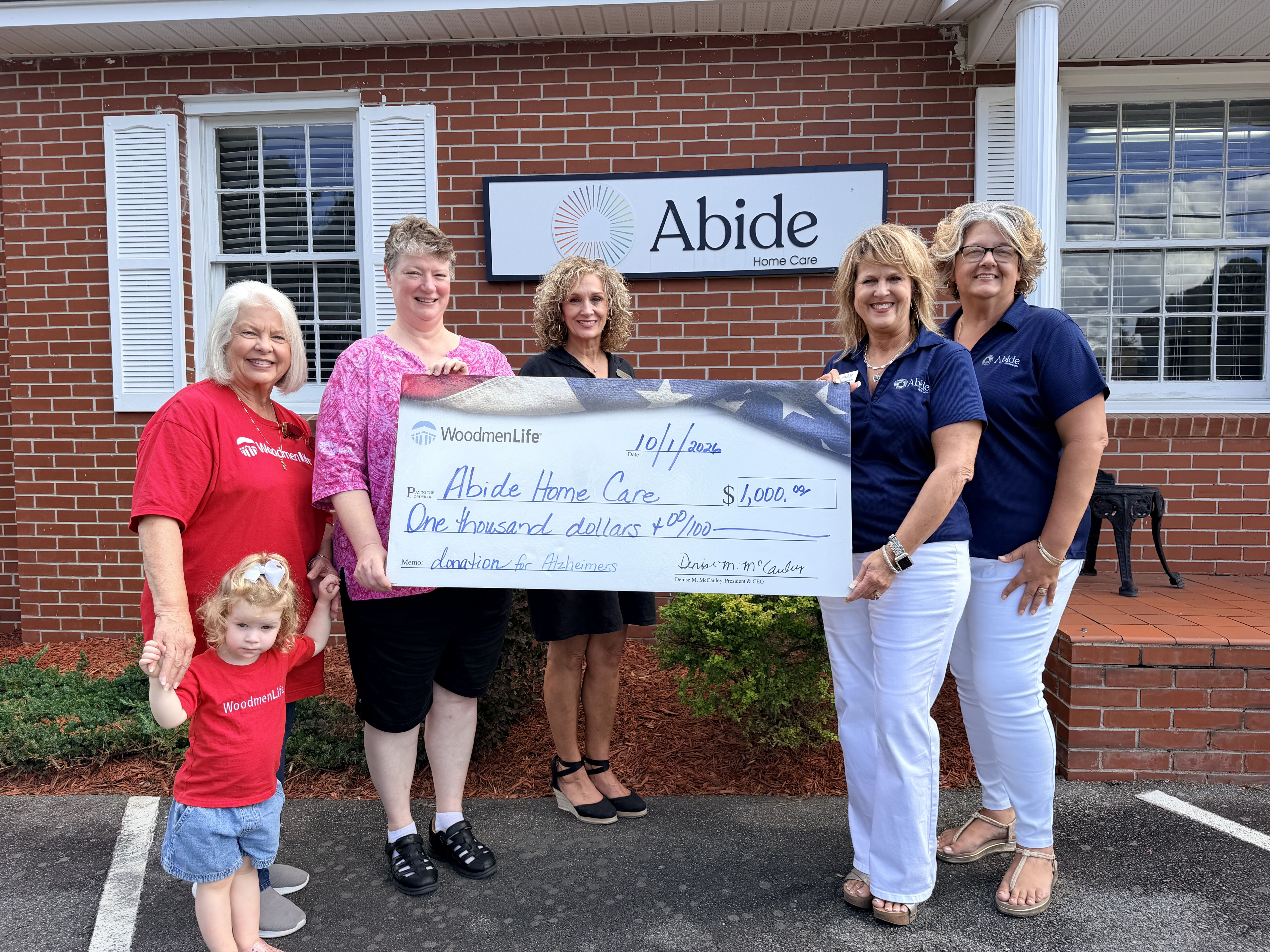 Abide Home Care Tifton & WoodmenLife Present $1,000 for the 2026 Walk to End Alzheimer’s Abide Home Care Tifton team with WoodmenLife representatives presenting a $1,000 contribution for the Walk to End Alzheimer's